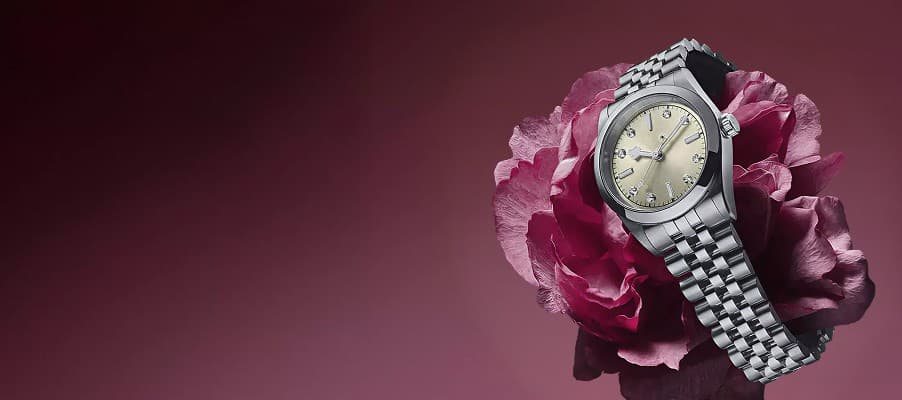A dress watch photographed on a neutral background